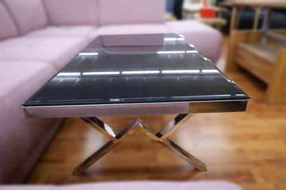 Black glass side table with chrome accents